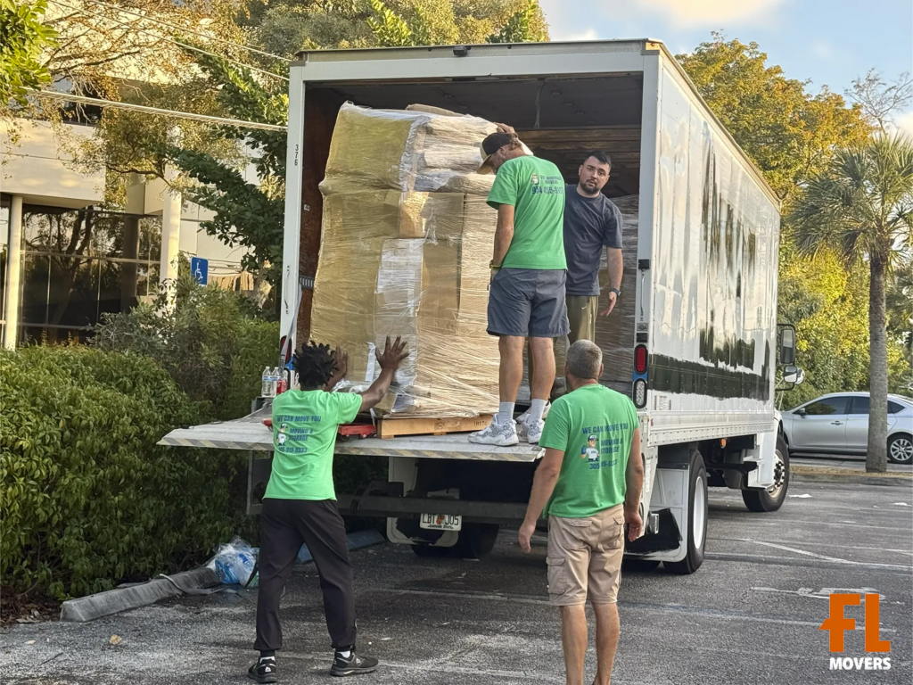 Team Members Unloading Packing Customer Boxes and Furniture in Truck