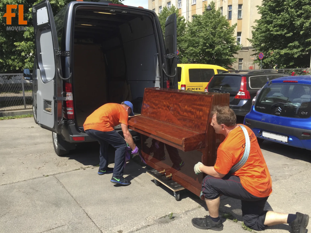 Team Members Loading Customer Piano in Truck Summer Special Items Move Team Members Loading Customer Piano in Truck